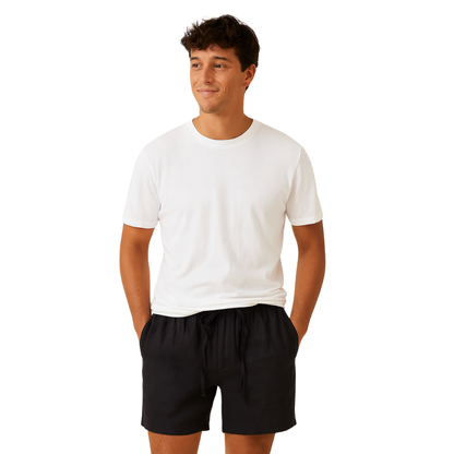 men’s loose linen shorts in black, front view – The Olace